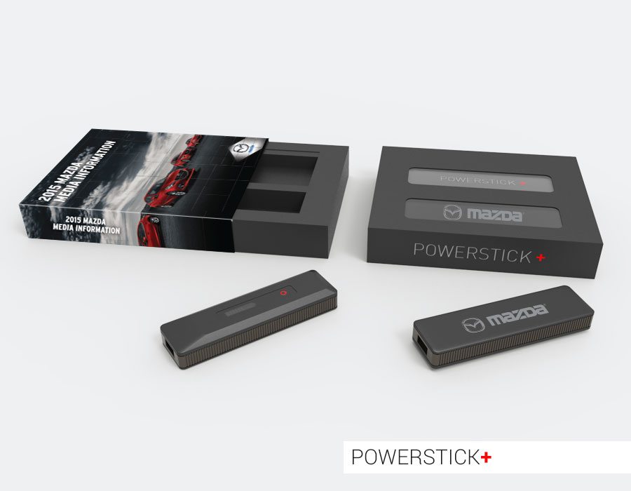 Black PowerStick+ portable phone charger with mazda logo